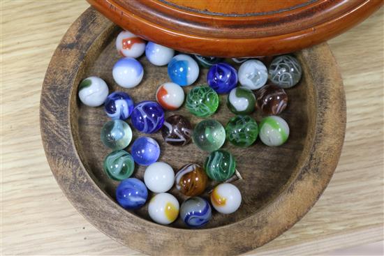 A treen solitaire board and marbles, a parquetry box and treen leaf tray